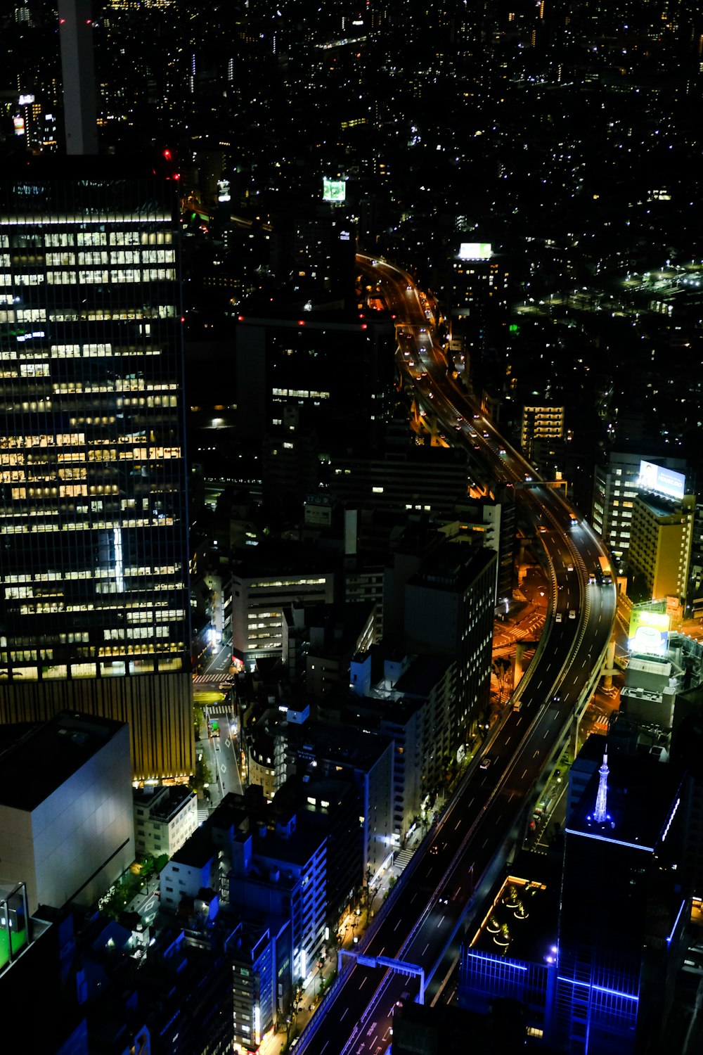 an aerial view of a city at night