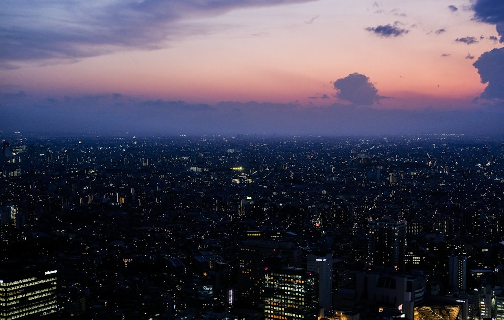 a view of a city at night from the top of a building