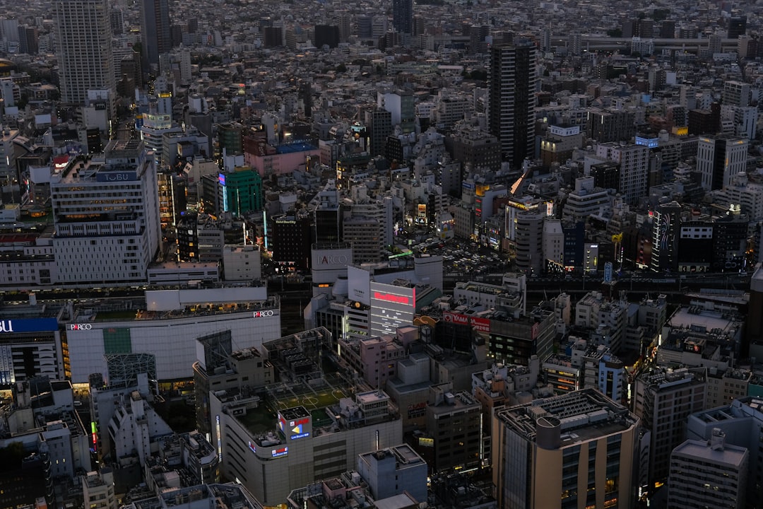 an aerial view of a city at night,
