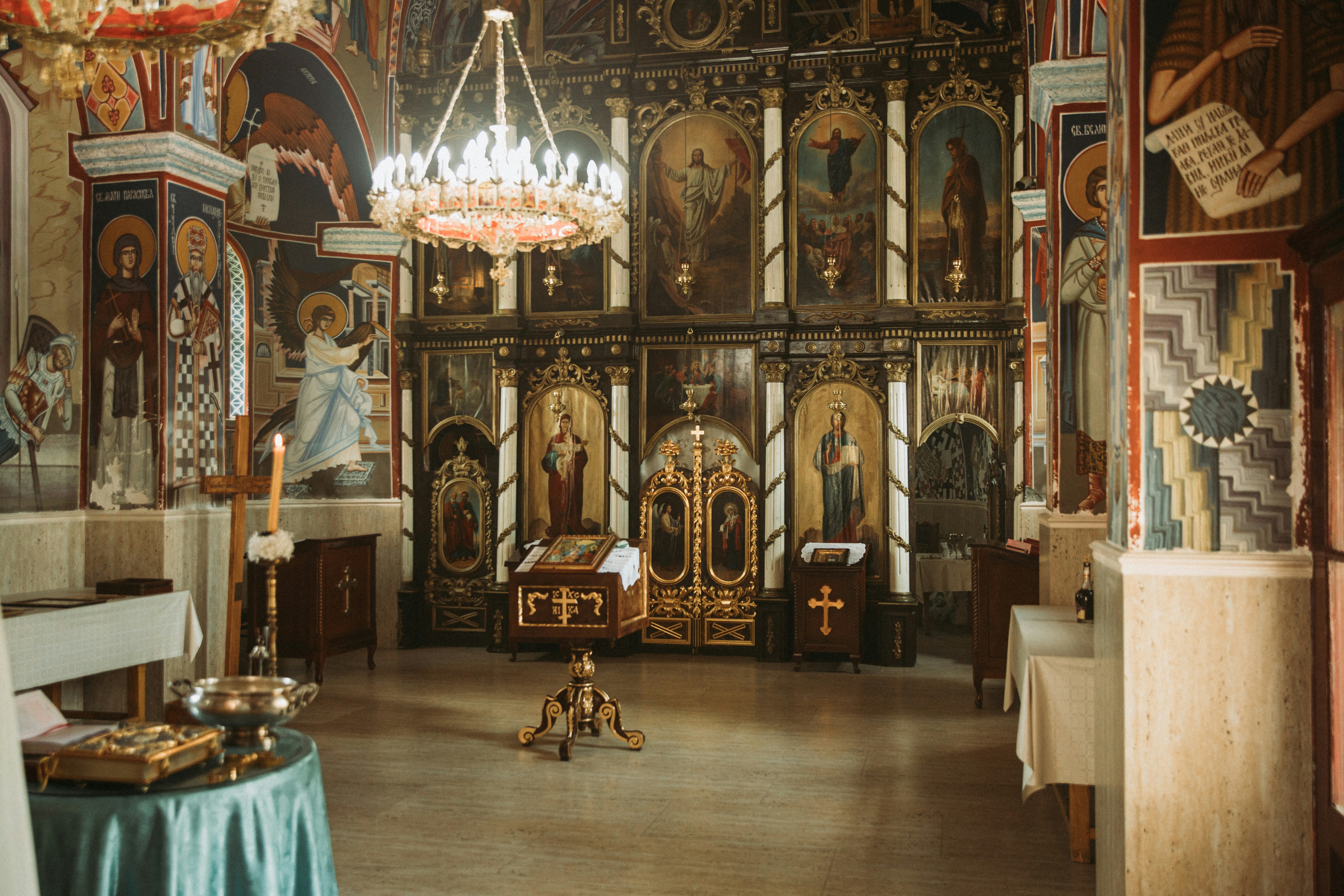 a church with a chandelier hanging from the ceiling
