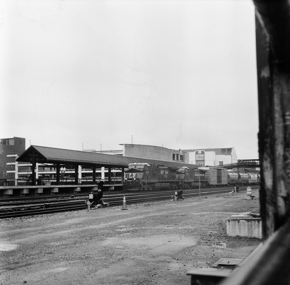 a black and white photo of a train station