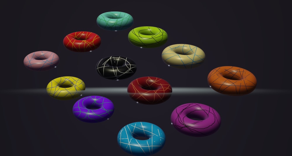 a bunch of doughnuts that are all different colors
