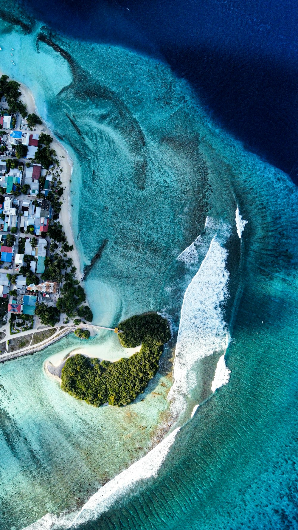 an aerial view of a small island in the middle of the ocean