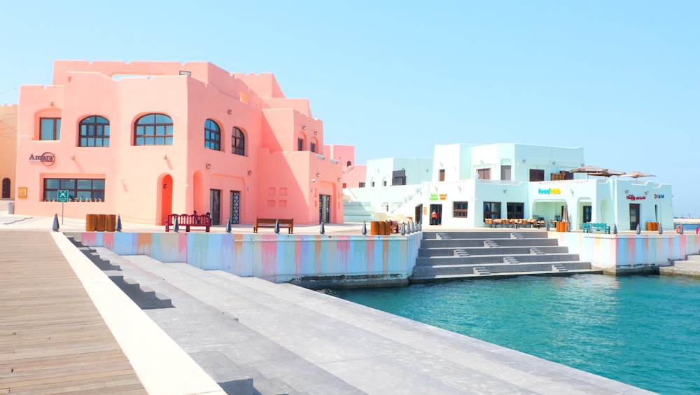 a row of houses next to a body of water