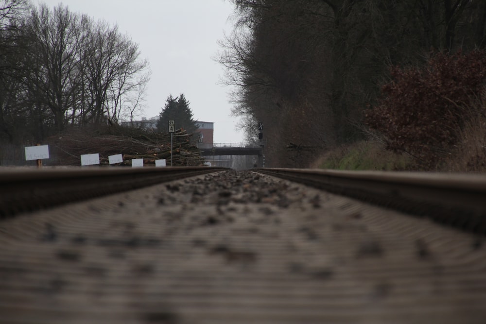 a train track with trees in the background