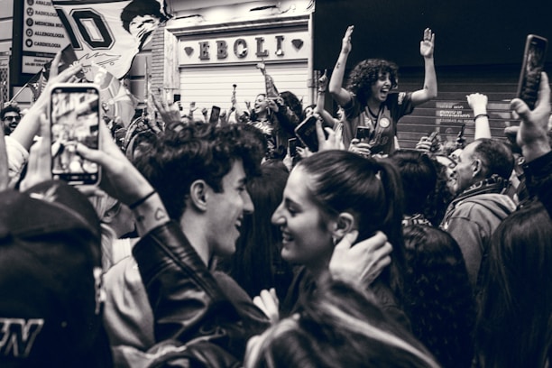 A vibrant crowd of meme enthusiasts celebrating a crypto milestone with Pepe frog and Doge icons.