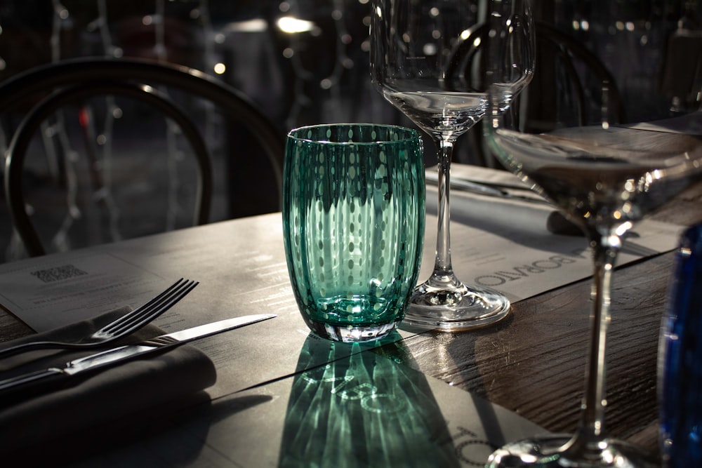 a close up of two glasses on a table