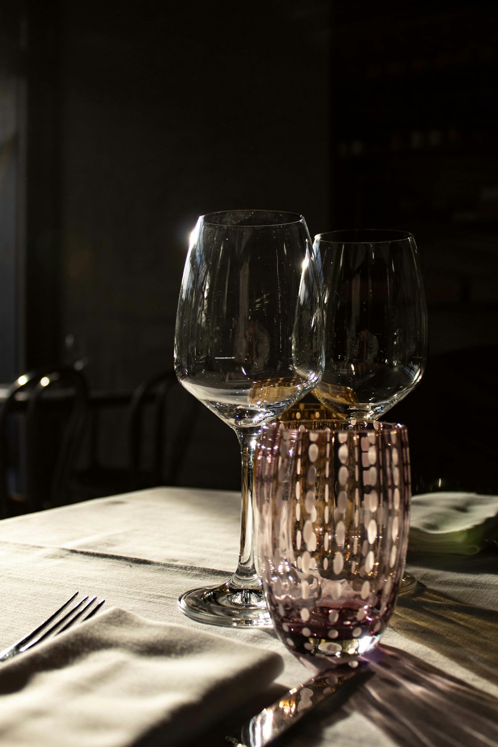 a couple of wine glasses sitting on top of a table