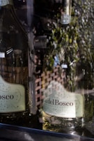 Glasses of Franciacorta sparkling wine reflecting golden light during a quiet evening.