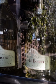 Glasses of Franciacorta sparkling wine reflecting golden light during a quiet evening.