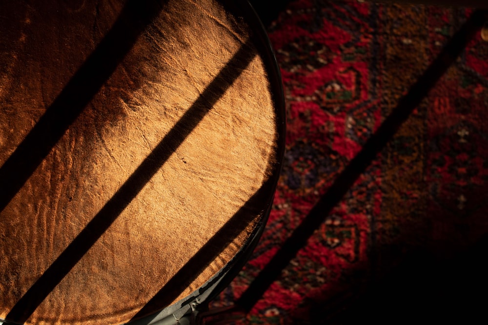 a close up of a drum on a rug