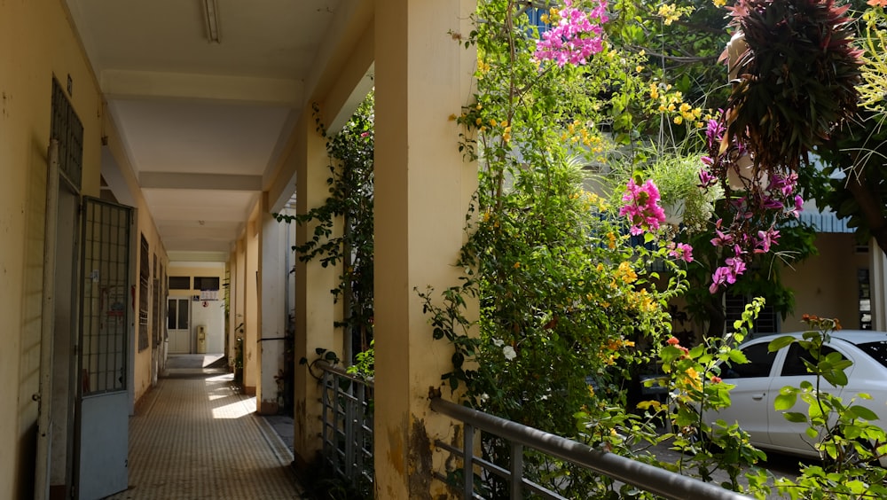 a long narrow hallway with a car parked on the side of it