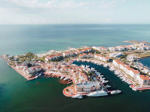 an aerial view of a marina in the middle of the ocean