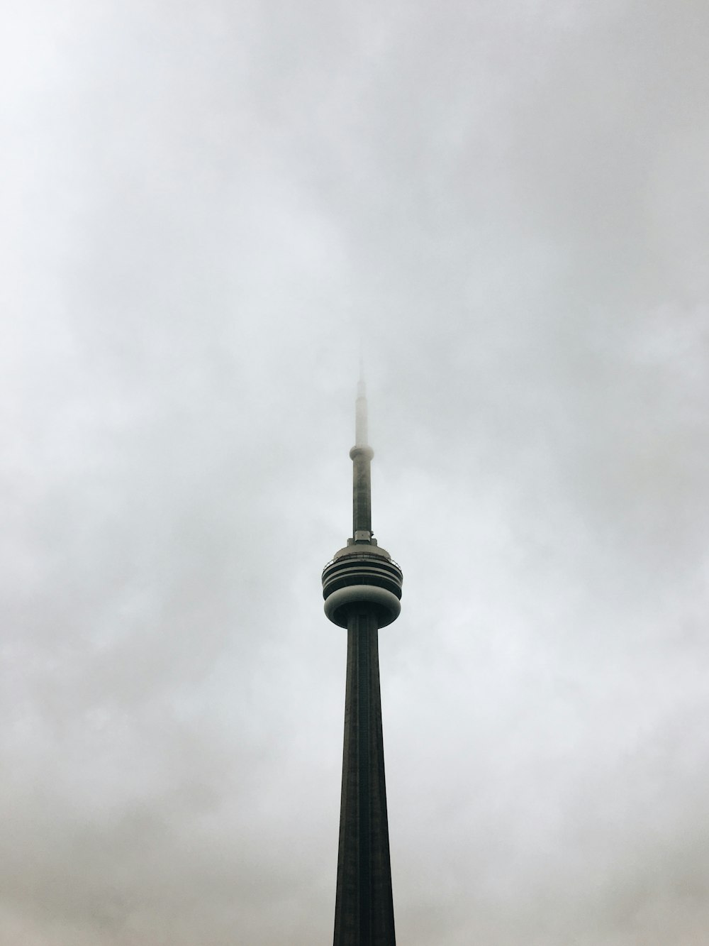 a tall tower with a clock on it's side