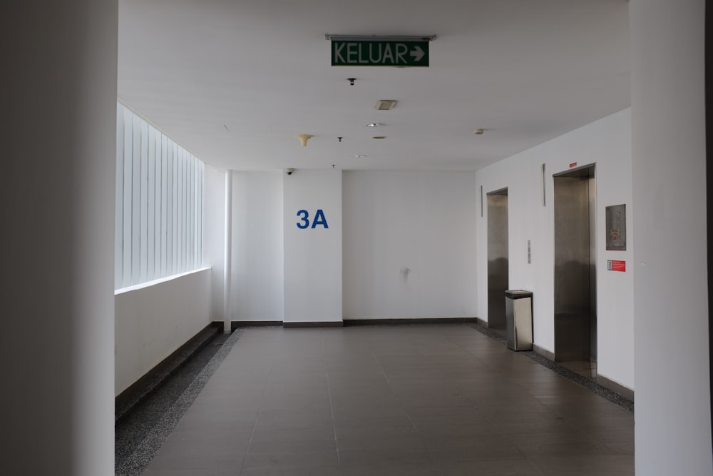 a hallway with a sign that says kelp - a - k on the wall