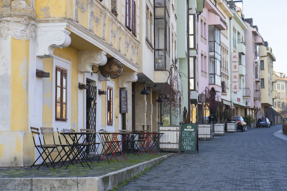 a cobblestone street lined with tall buildings