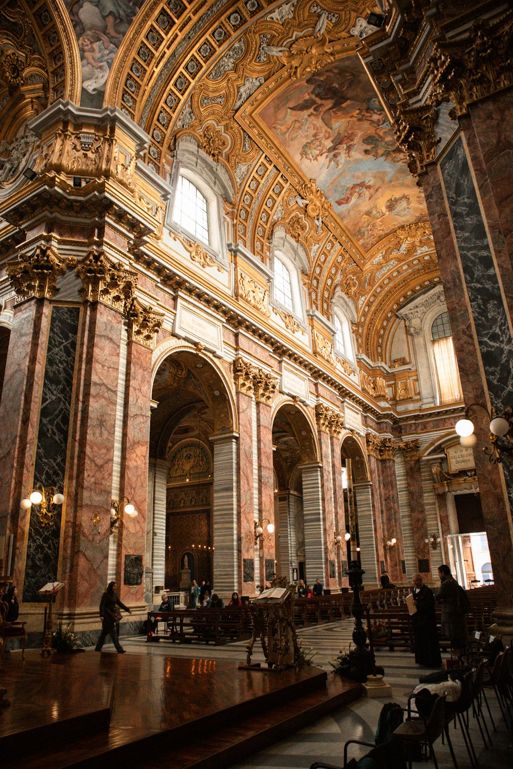 a large room with a painting on the ceiling