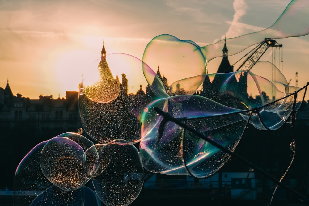 soap bubbles floating in front of a city skyline