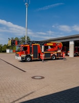 East Campbell fire truck parked outside the station with safety green accents visible.
