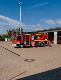 East Campbell fire truck parked outside the station with safety green accents visible.