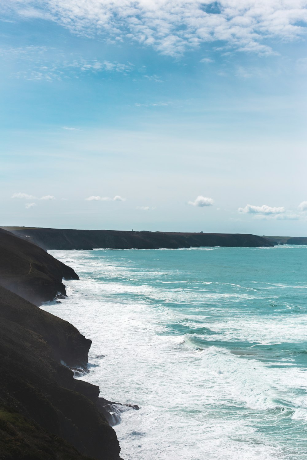 a view of the ocean from a cliff