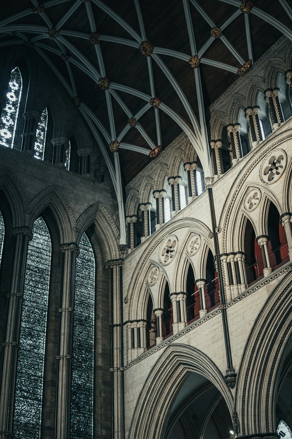 the inside of a cathedral with a clock on the wall