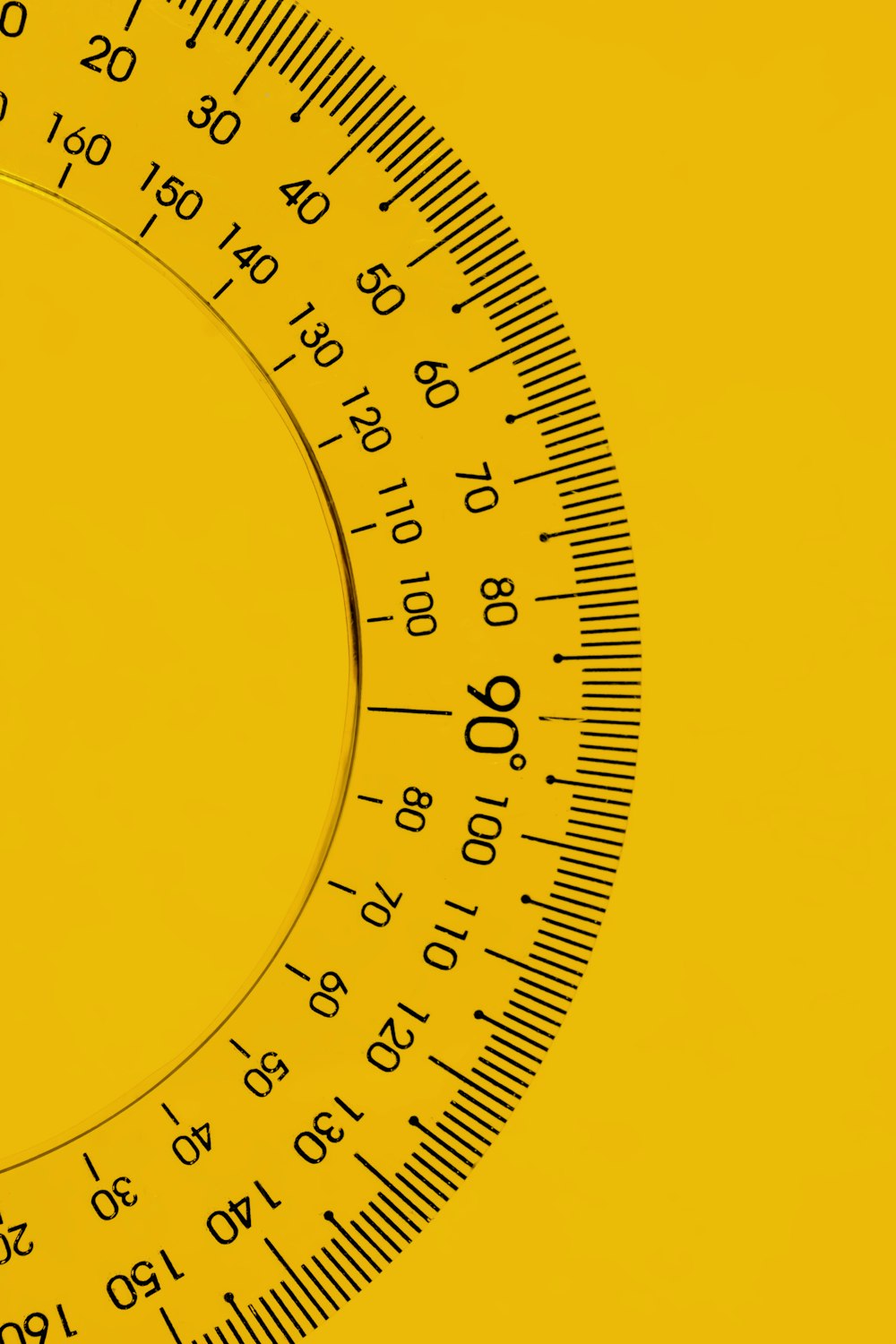 a close up of a yellow and black clock