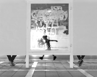 Runner passing urban graffiti wall, capturing energy and movement.