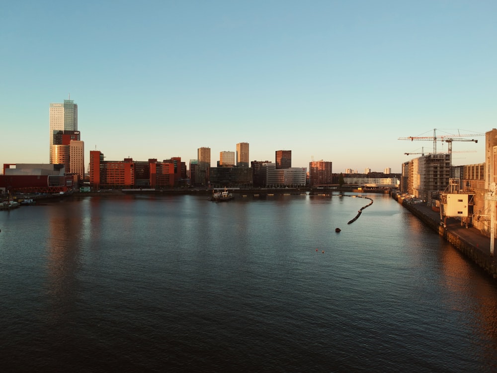 a large body of water with a city in the background