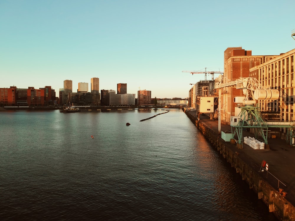 a body of water with a city in the background