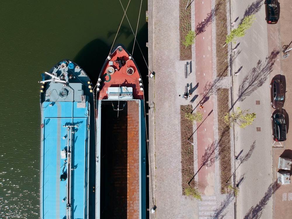 two boats are docked next to each other on the water