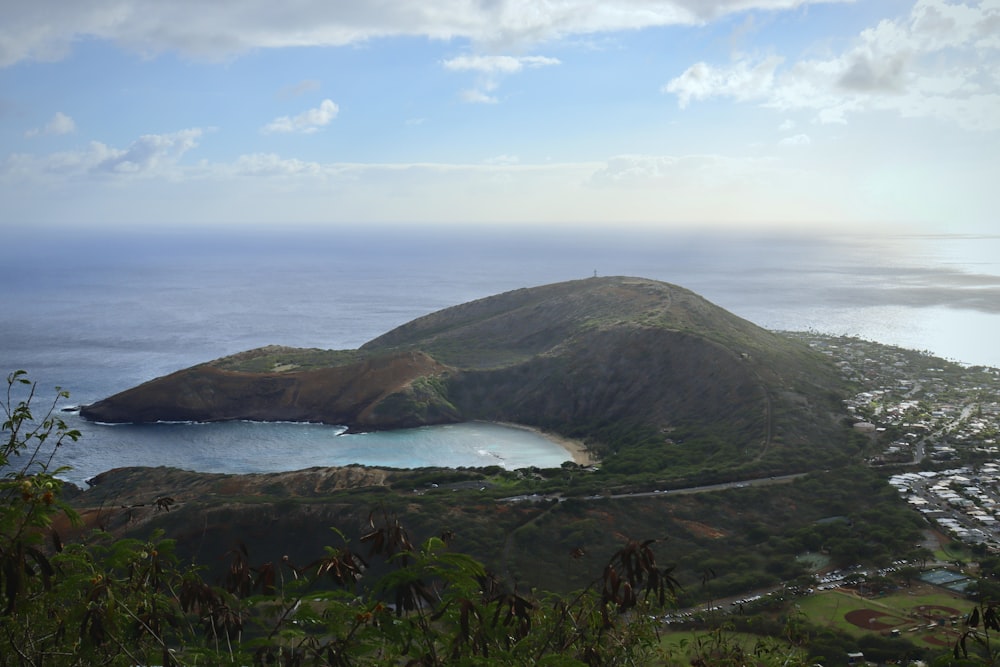 a view of a small island in the middle of the ocean