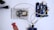 A microcontroller development board, breadboard, and various electronic components are arranged on a surface. Wires connect the components, indicating a circuit setup. The setting is clean with a focus on electronics and hardware prototyping.