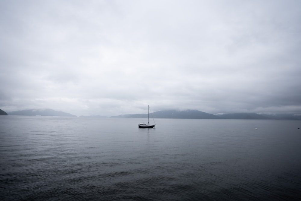 a boat floating on top of a large body of water