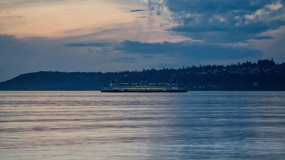 a large boat floating on top of a large body of water