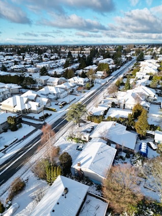an aerial view of a snow covered neighborhood