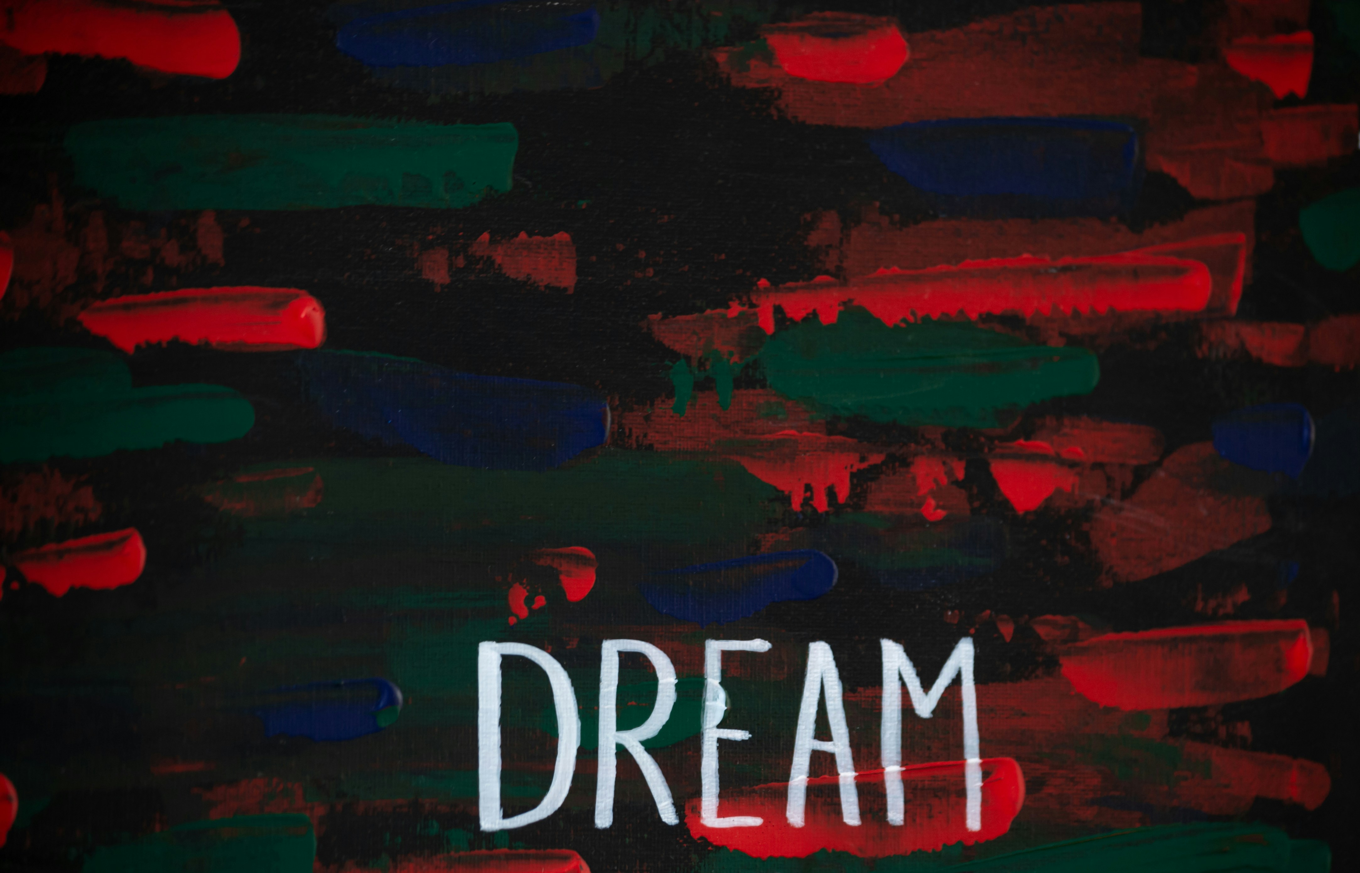a painting with the words dream written on it