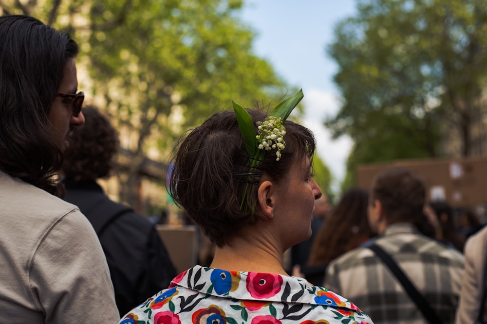 a woman with a flower in her hair