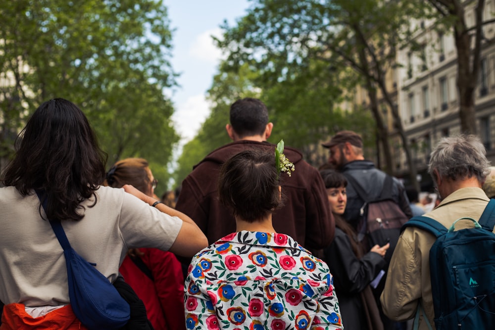 a group of people walking down a street