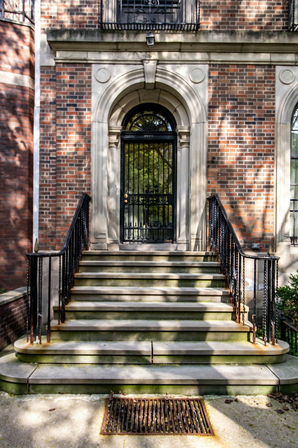 a large brick building with stairs leading up to it