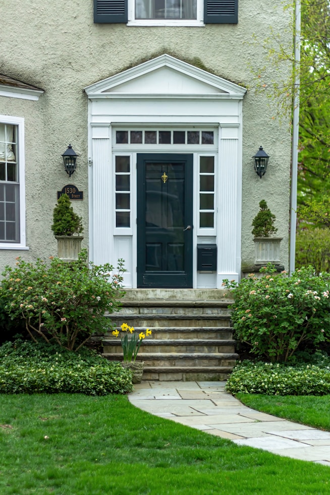 a house with steps leading to the front door