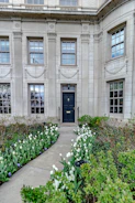 Elegant building entrance with warm tones and welcoming atmosphere.