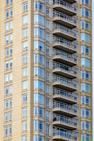 Wide shot of a high-rise exterior showing waterproofing and insulation layers.