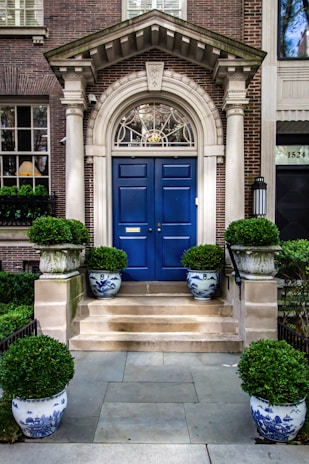 Elegant office entrance with dark blue and gold accents reflecting professionalism.