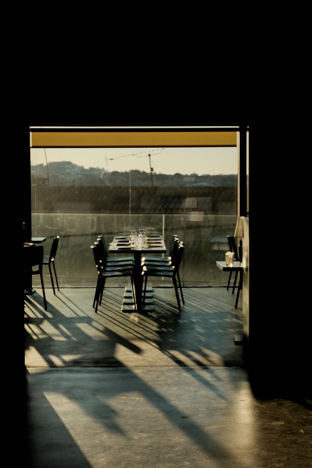 a dining room with a long table and chairs