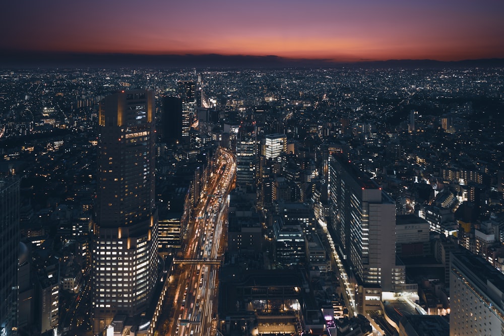 a view of a city at night from the top of a building