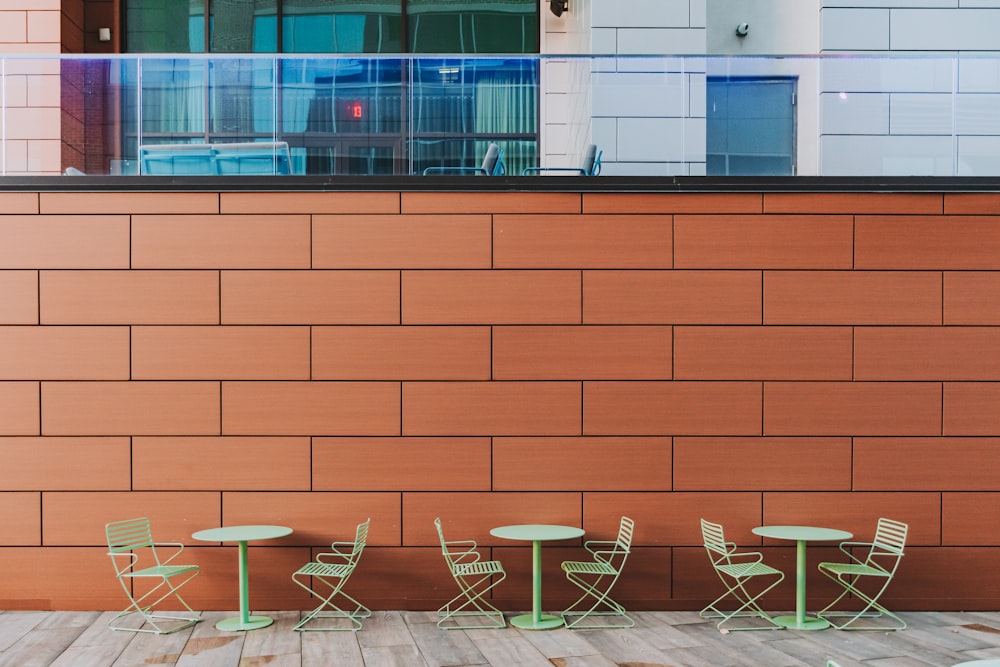 four chairs and a table on a wooden floor