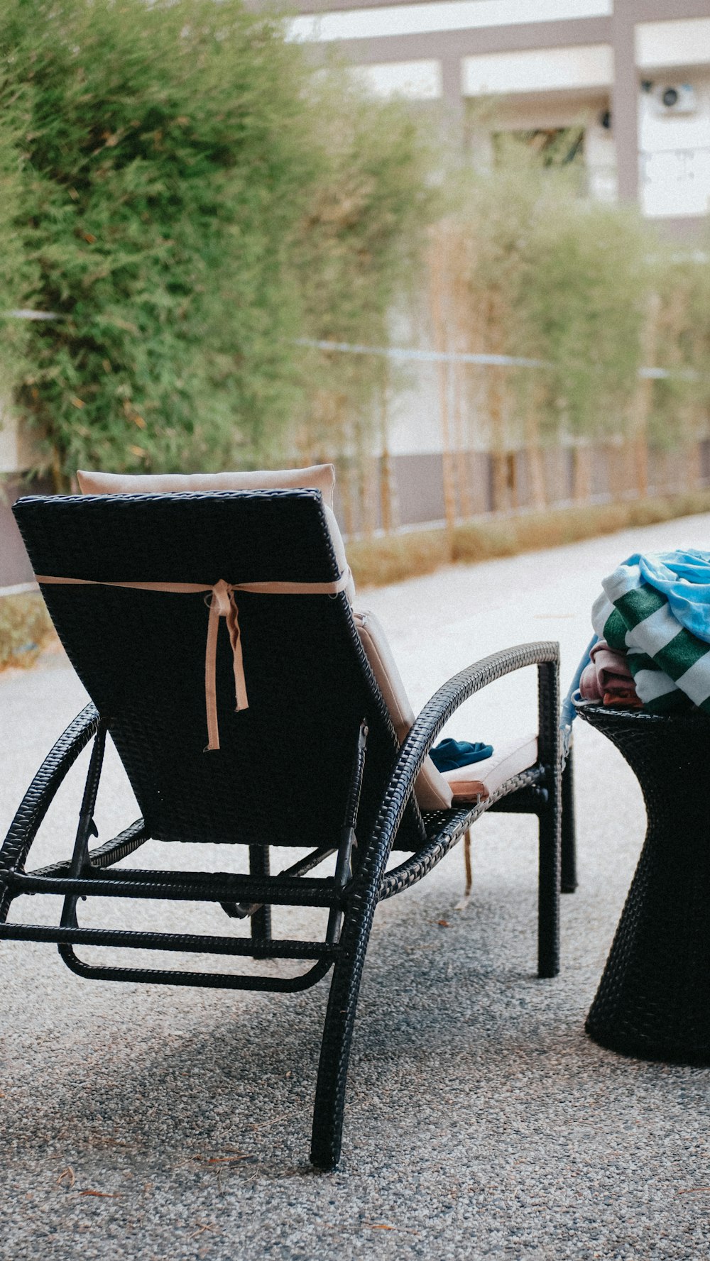 a chair and a table sitting on the side of a road