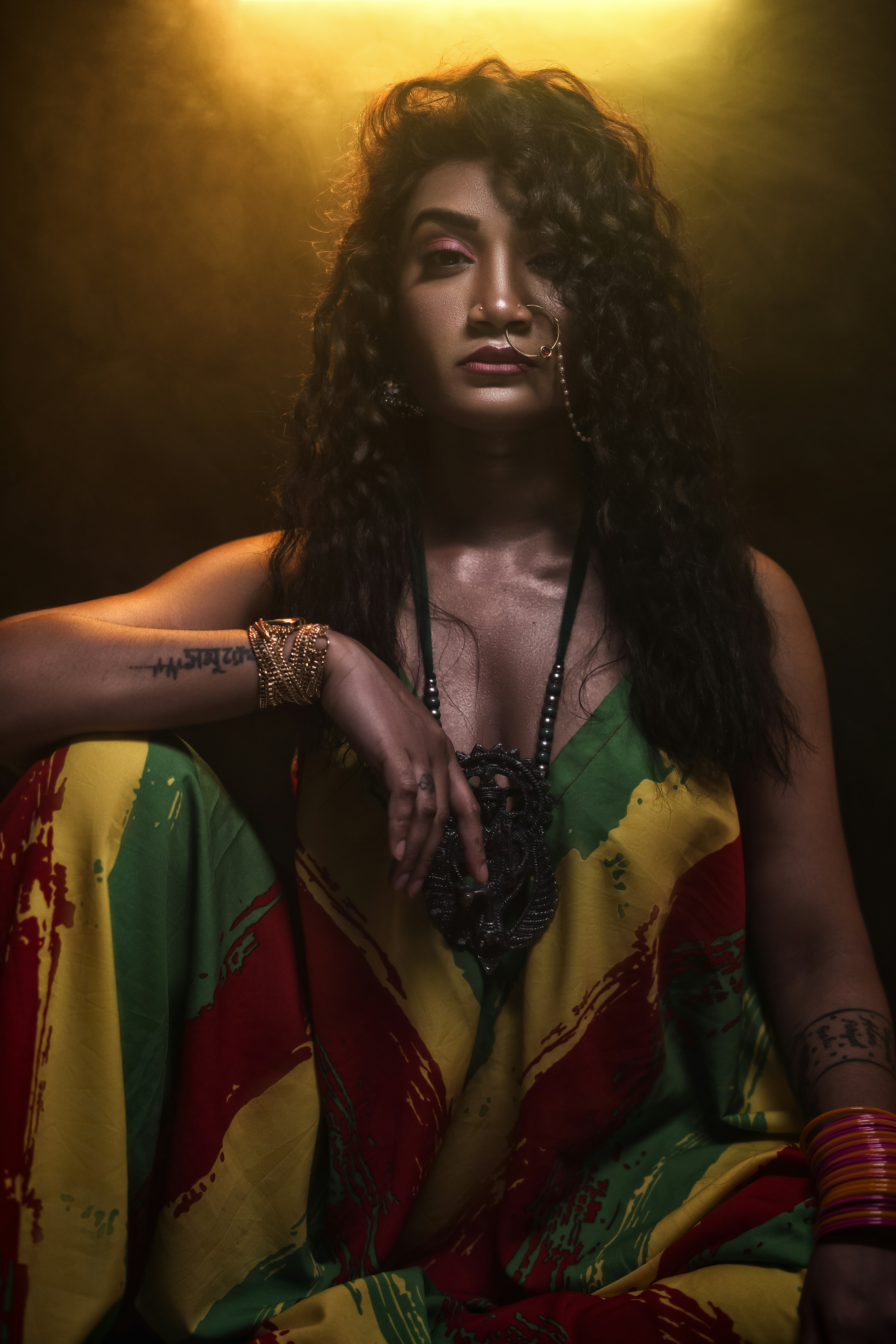 a woman with long hair sitting on a chair