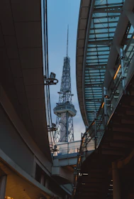 A professional setting showing a 4-5G network tower transmitting signals across a cityscape.